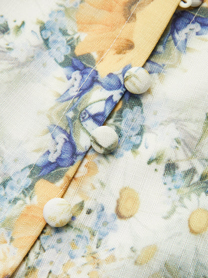 Vestido floral con mangas globo y cinturón